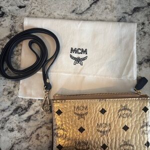 MCM new without tag Gold Pouch with Black and lanyard strap type